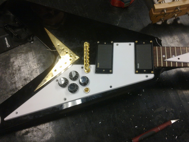Flying V black with new pick guard.jpg